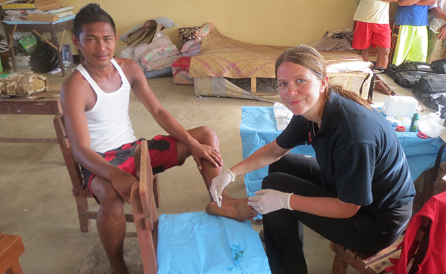 Deborah Lau, one of Merlin's medical experts treats a Typhoon survivor on Panay 