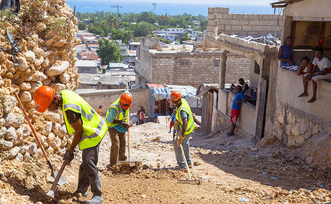 The long road to rebuild: construction workers clear rocks in Carrefour, Haiti. 