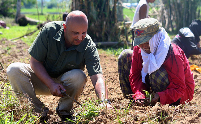 Chadra prepares land to grow vegetables, this DEC funded scheme enables vulnerable families to earn an income.