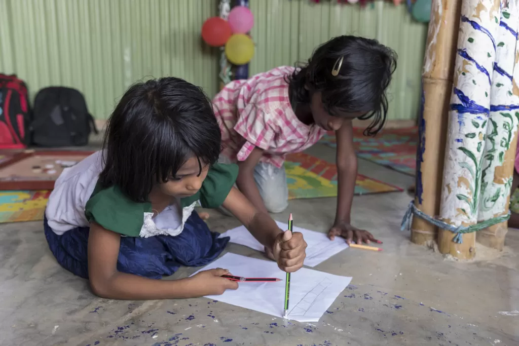 Girls play in a girl-friendly space in the camps for people who have fled Myanmar.