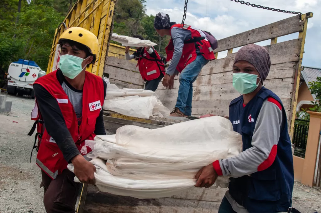 British Red Cross affiliate Indonesian Red Cross deliver food, shelter and other aid items to people affected by the earthquake and tsunami in Palu, Indonesia.