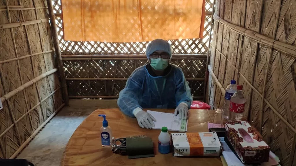 A doctor being supported by Christian Aid in the Rohingya refugee camps in Cox's Bazar, Bangladesh, waits for his next patient.