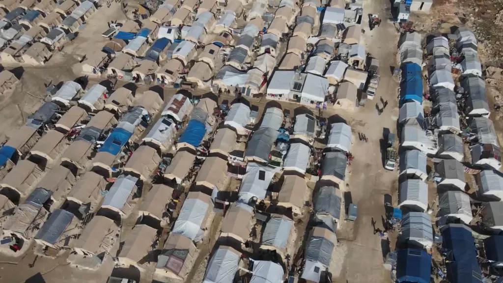 An aerial view of a displacement camp in Syria showing rows and rows of tents