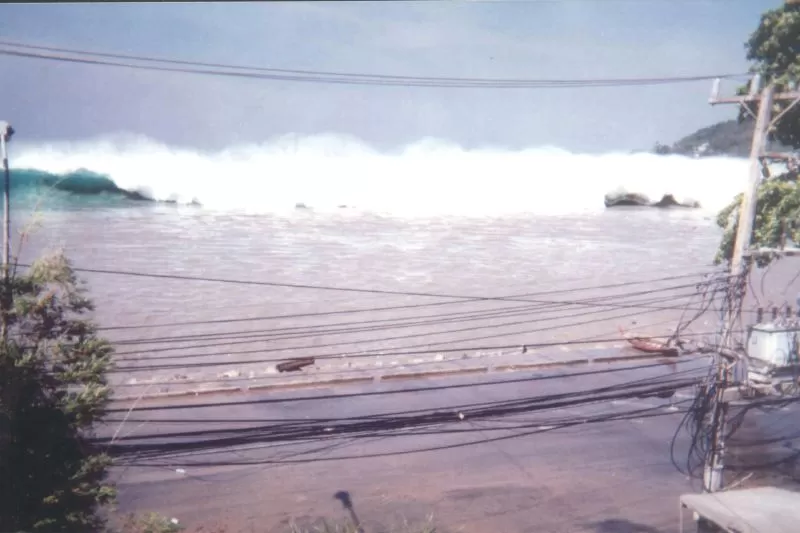 A tsunami wave approaching a beach