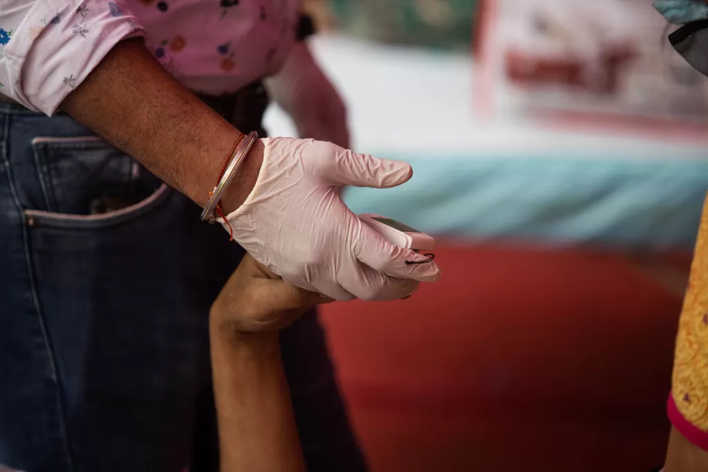 A doctor measures a patient's oxygen levels