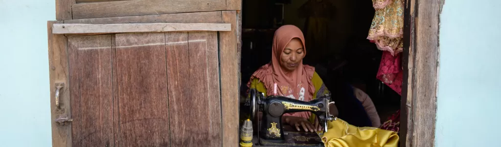 A woman uses a sewing machine