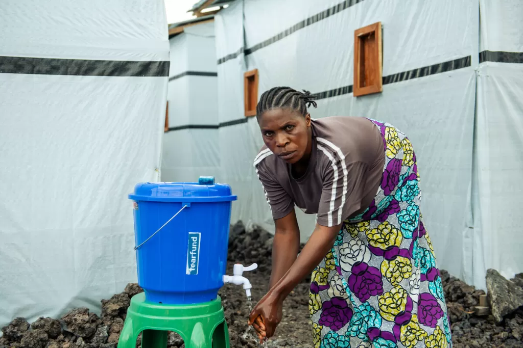 A camp resident near Goma in DR Congo is able to access clean water as part of Tearfund's water, sanitation and hygiene programmes.