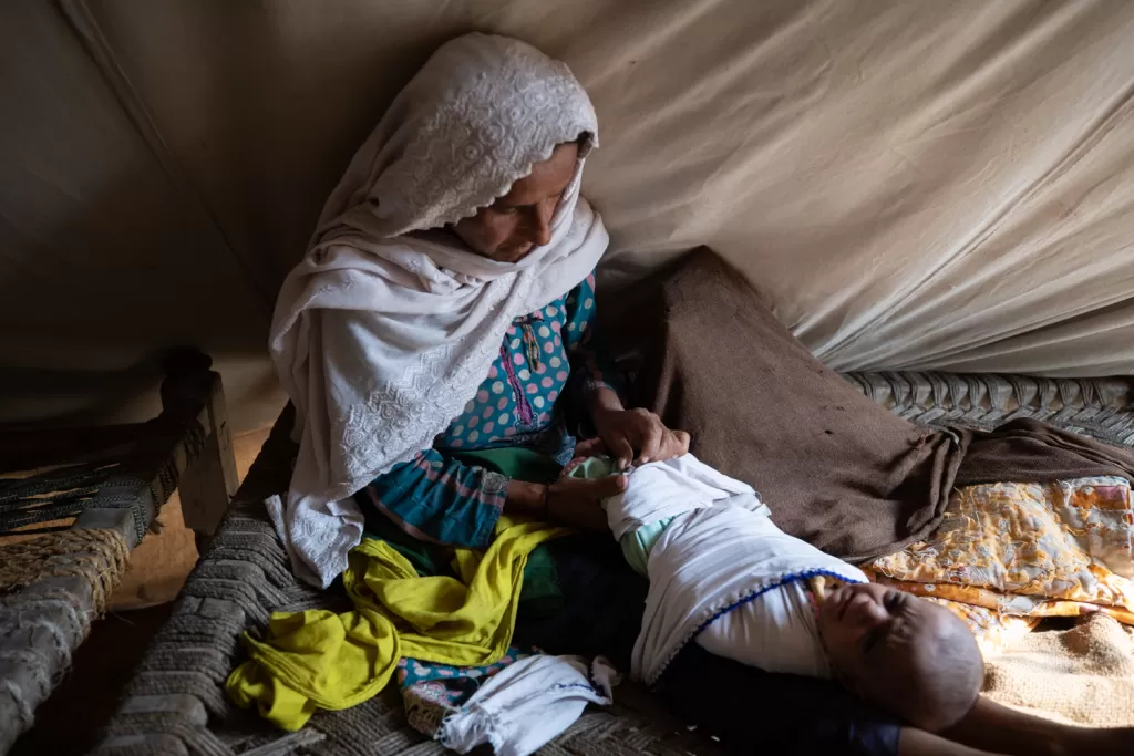 Noor gave birth to her baby soon after her house collapsed in the floods.