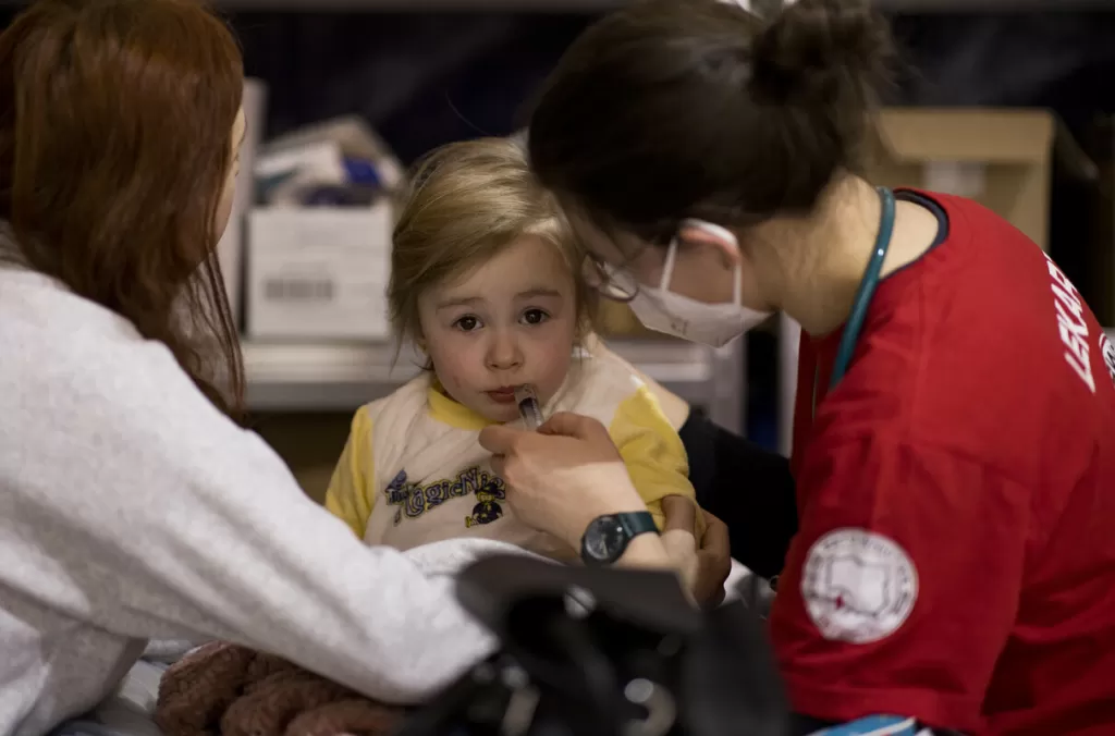 Oksana’s* daughter is cared for by a medical team in Poland