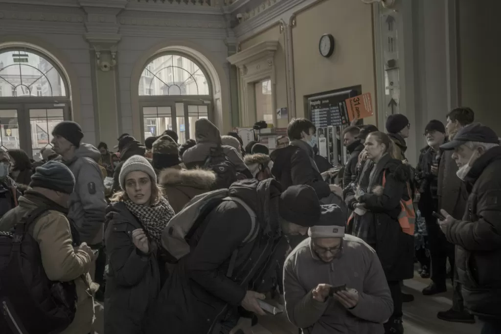 Refugees at Przemysl railway station, Poland receive information and support.