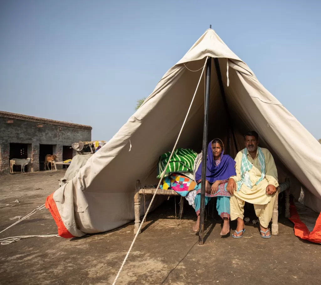 Jeyand and his wife in the tent provided by Save the Children