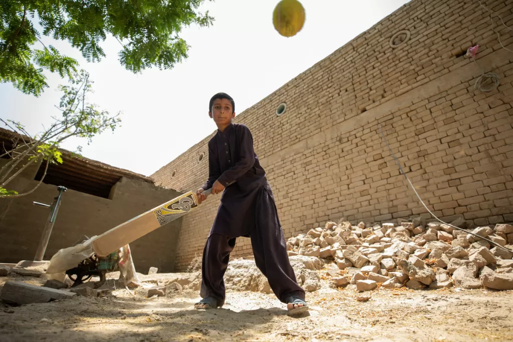 Arslan playing cricket in a safe play space