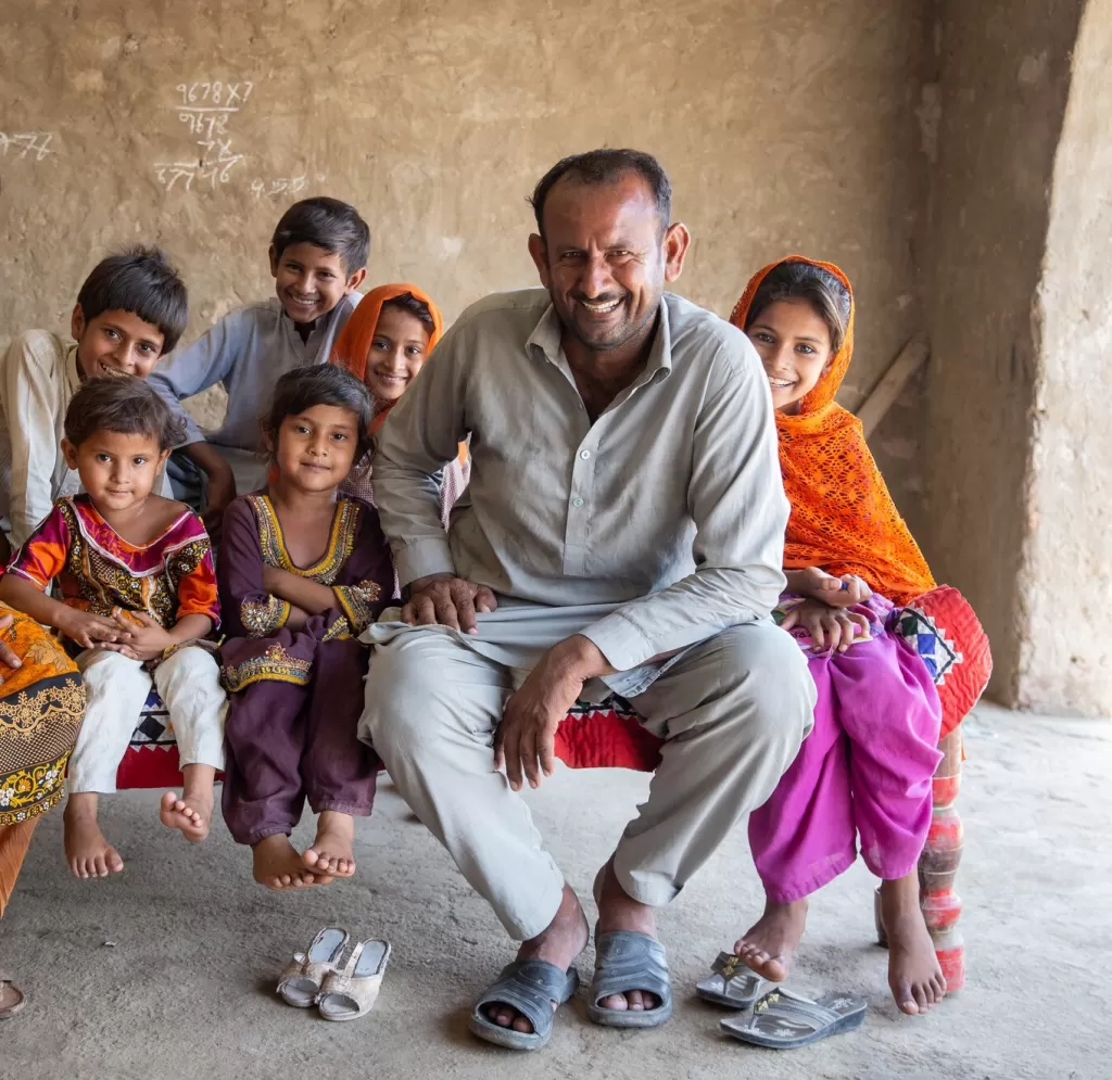 Maula Dinno smiling with his family