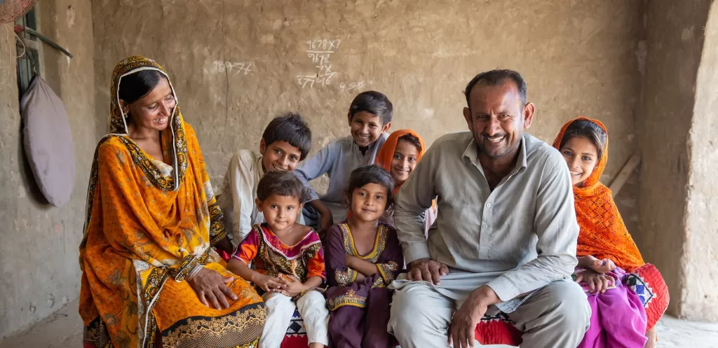 Maula Dinno smiling with his family