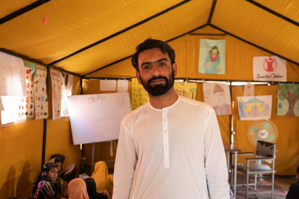 Yasir teaches at the tent school by Save the Children