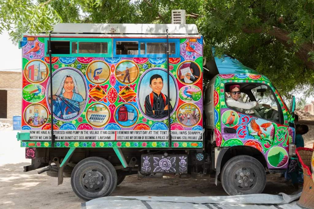Artist Ali Salman drives the painted aid truck