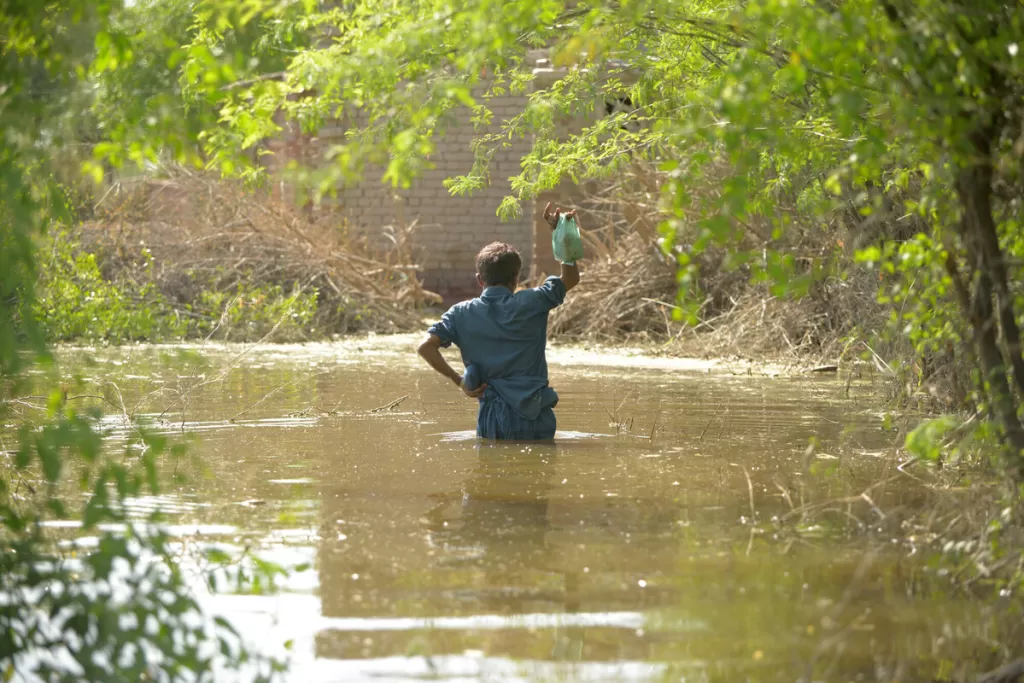  A man wades through floodwater in Mitiyari Hyderabad, Sindh, Pakistan on 3rd September 2022