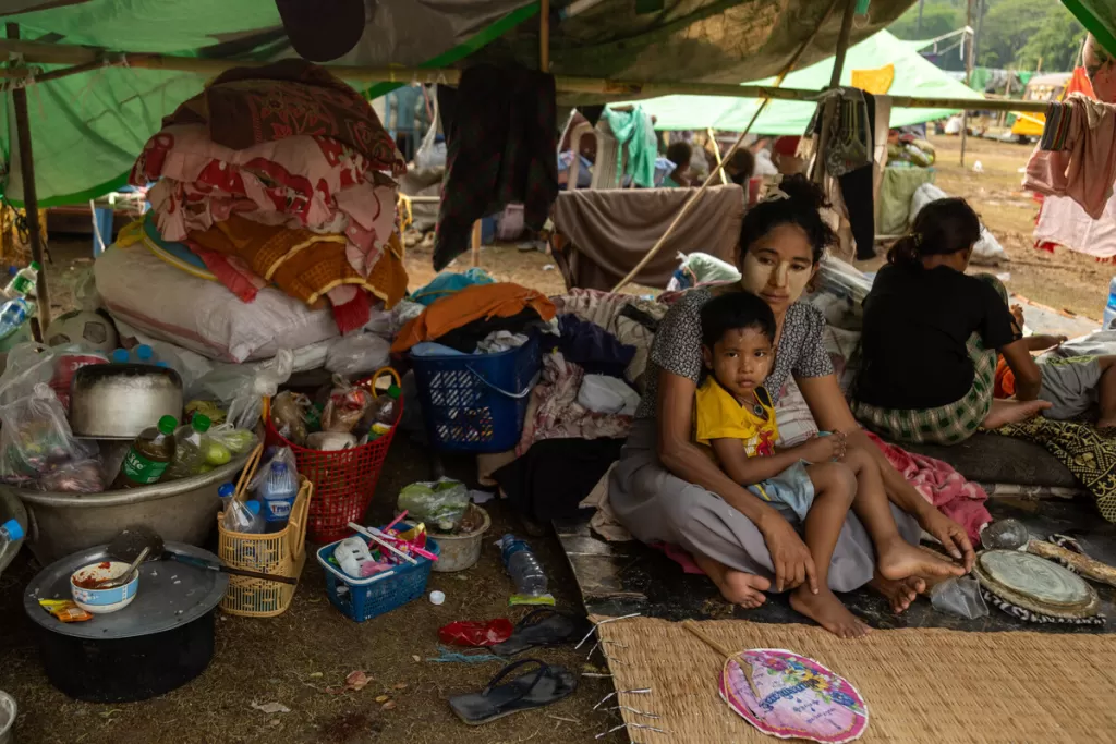 Women shelters in camp in Myanmar with her child