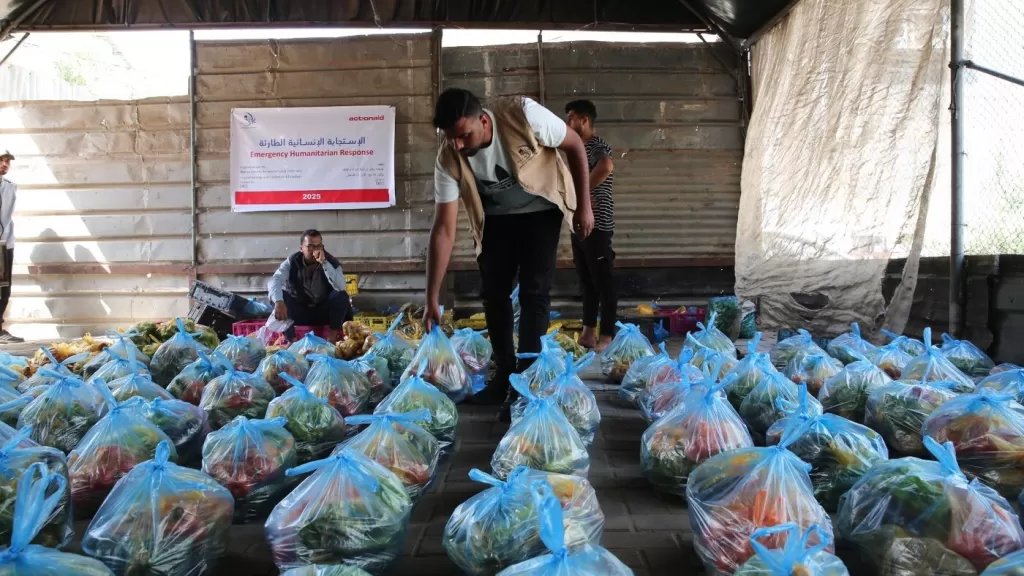 DEC charity ActionAid's local partner in Gaza, Wefaq Society for Women and Child Care, carry out a delivery of DEC funded fresh vegetables in food packages, 4 May 2025.