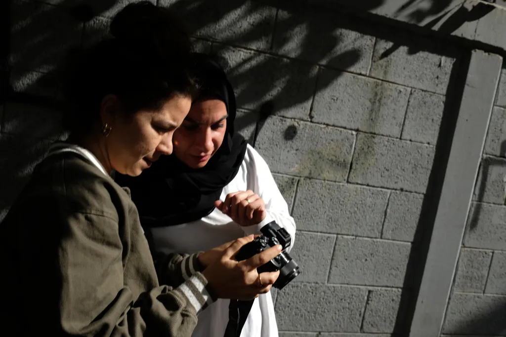 Two women look at camera