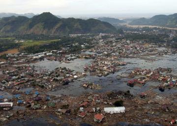 An aerial image shows a town inundated with water