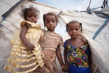 Three sisters in the camp they fled to with their parents.