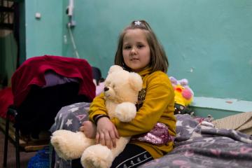 Olesia* plays after school in a public bomb shelter in Kharkiv.