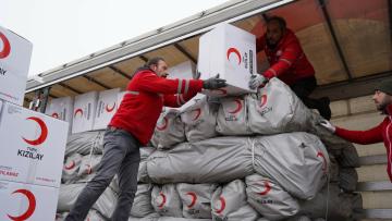 Teams from the Turkish Red Crescent deployed in ten affected provinces with stocks of food and basic aid items