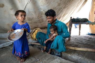 24 year old Jaitha, with his children Hari* and Meena* in their personal tent