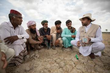 Dr Iqbal teaches farmers new climate-smart farming techniques