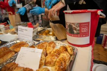Bucket and pastrys at fundraising event for Turkey-Syria earthquake appeal