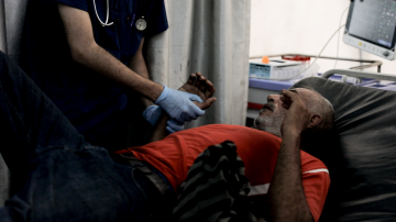 A patient receives treatment at a DEC supported Palestine Red Crescent Society field hospital in Gaza on 31 July 2025. Photo: Aya Matrabie/Fairpicture/DEC