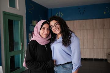 Rafce (r) provides women like with Abir (l) with support services at a community centre in Beirut, Lebanon. Photo: Amy Sheppey/Christian Aid/DEC