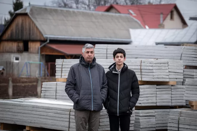 An Afghan man and his son after fleeing to Romania from Ukraine