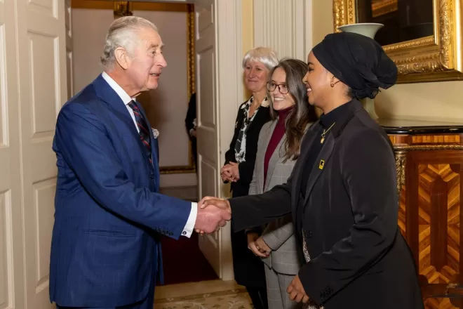 His Majesty The King shakes hands with IRC representative at Buckingham Palace