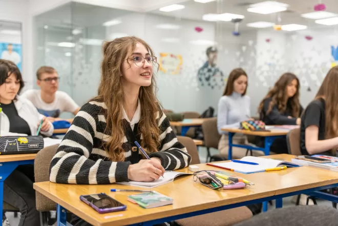 A Ukrainian girl sits in a classroom in Poland