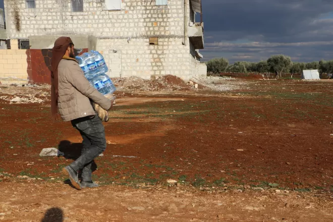 Syrian Expatriate Medical Association (SEMA) delivering water to people affected by the earthquake. HelpAge international is working through partner Syrian Expatriate Medical Association (SEMA) to deliver the humanitarian response that is inclusive of older people, especially older women and those with disabilities.