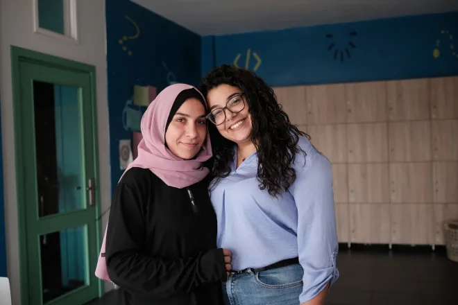 Rafce (r) provides women like with Abir (l) with support services at a community centre in Beirut, Lebanon. Photo: Amy Sheppey/Christian Aid/DEC