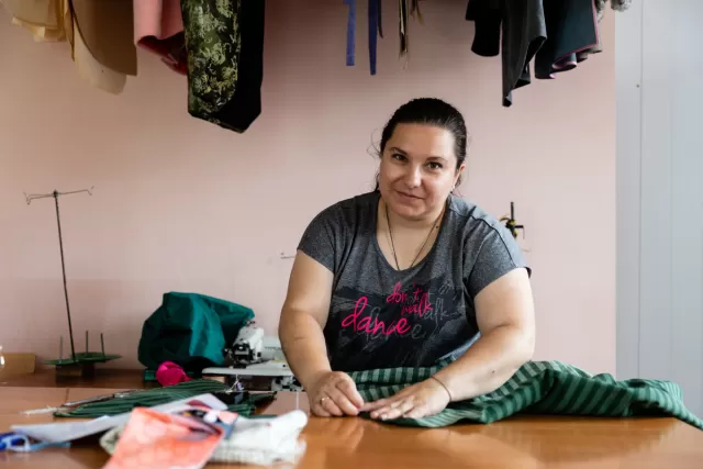 Tamara* receives vocational training in tailoring in Mykolaiv, Ukraine, to help earn a living again. Photo: Katya Moskalyuk
