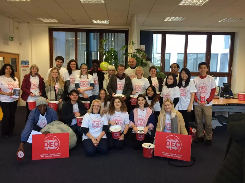 A group of volunteers ready to raise money at a rugby match